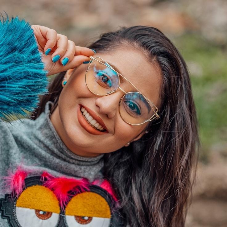 Avery Chen, Lead Design Curator at AtlasPaperCrown, reviewing corporate floral arrangements